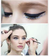 Diamantine eyes with sharp black eyeliner and crystal-bedecked lower lashes