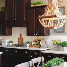 This is an ideal choice for cabinets that are flush to the wall without space to. 9 Ways To Decorate Above Your Kitchen Cabinets