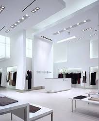 It uses straightforward furniture and dramatic modern art to complement the stark architecture. Retail Interior Design Store Interiors Shop Interiors