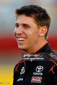 Andy Lally, driver of the TRG Motorsports Ford, walks