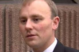 Brave police officer clear of dangerous driving rap after knocking banned  driver off bike