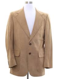 I'd go so far as to say it's downright kingly. Vintage Clothes Horse Seventies Jacket 70s Clothes Horse Mens Camel Tan Napped Washable Faux Suede Jacket Having Wide Lapels Flowing To The Two Round Light And Dark Brown Button Closing A Trio