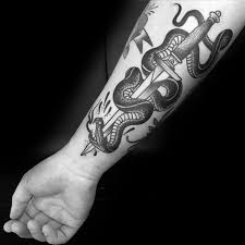 You're supposed to leave it there for a day or two so the tattoo can scab over peacefully. 50 Snake Dagger Tattoo Ideas For Men Sharp Serpent Designs