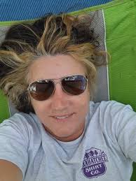 Unpacking car after solo camping trip with kids