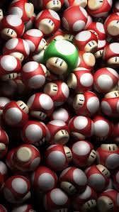 Figura de hongo verde (green mushroom) dentro del universo de mario bros que otorga una vida extra dentro del juego. Verde Y Rojo Fondos De Mario Bros Fondos De Pantalla De Juegos Fondos De Mario