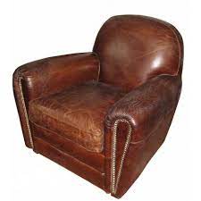 Ce fauteuil oeuf cocoon aviateur noir est en cuir pleine fleur et version métal riveté. Fauteuil Club