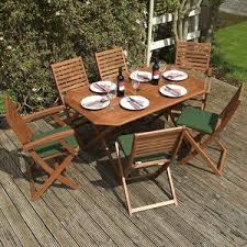 Rowlinson Plumley 6 Seater Dining Set With Cushions Wayfair Co Uk Wooden Garden Furniture Wooden Dining Set Garden Furniture Sets