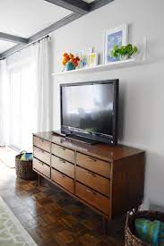 Floating tv stand component shelf wall mounted media console hanging tv console with drawers and cabinet doors game console wall entertainment center for cable boxes/routers/remotes : A Cheap Easy Shelf For That Blank Spot Over The Tv Young House Love