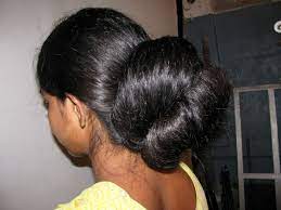 Another classic indian bridal look, this gorgeous hairstyle is a very stylish way of wearing your hair for the wedding, featuring long, loosely curled locks to the side that add an element of messy that complements the perfectly styled parting up top and the immaculate bun. Indianrapunzels On Twitter Thick Long Hair Bun Play Https T Co V31bqhcama Longhairbunplay
