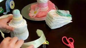 See more ideas about baby shower gifts, diaper, boat diaper cake. How To Make A Diaper Cake Baby Bottle Youtube