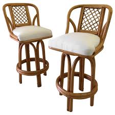 Swivel bar stools for sale. Pair Of Bamboo Tall Swivel Bar Stools Vintage Sunbrella Fabric For Sale At 1stdibs