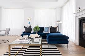 These comfortable sofas & couches will complete your living room decor. Sapphire Blue Velvet Sofa With Chaise Lounge And Black And White Striped Rug Contemporary Living Room