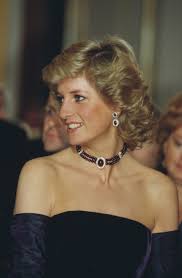 Lady diana has long red hair tied in a bun and supported with her wedding dress and a huge pink heart necklace. Princess Diana Hair Evolution Feathered Shags Sleek Pixie Cuts And More Vogue