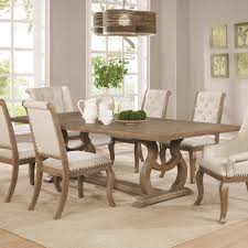The wood used in the formal dining sets is crucial in establishing the theme of the room. Glen Cove Weathered Extendable Rectangular Dining Table