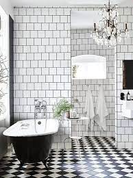 The tiles are cut into elongated rectangles and laid in a herringbone pattern for added style. 16 Black And White Bathroom Floor Ideas White Bathroom Bathroom Flooring Bathroom Design