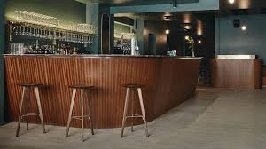 We repainted the fireplace beige tile all white to give it a boost and give it a more updated look without breaking the budget. Helsinki S Jackie Bar Takes Its Design Cues From 60s And 70s Disco Music