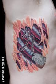 The issue of tattooing your pet is one that continues to be. Dog Tag Rib Cage Tear Out Tattoo By Marvin Silva Tattoonow