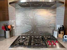 Choosing a backsplash for your kitchen can be an exciting, yet daunting task. Tree Of Life Stainless Steel Backsplash Stainless Steel Backsplash Stainless Steel Kitchen Backsplash Backsplash