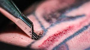 Master doing tattooing in tattoo studio. Close Up Slow Motion Video Of A Tattoo Being Inked