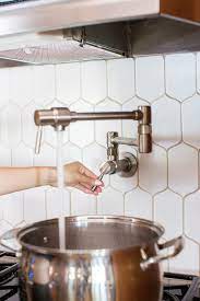 This faucet features the convenience and safety of two valve controls and an articulated arm that extends to the maximum spout reach of 22.5 inches. How To Install A Pot Filler And Where Diana Elizabeth