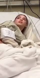 Patient Rachel Takes It Hard in Hospital Bed