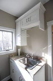 Installing new wall cabinets in your kitchen is an advanced project, but following these steps can save you the cost of hiring a professional. Mullet Cabinets Laundry Room Cabinets Laundry Room Laundry Room Decor