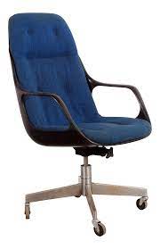 The brightly colored fabric and flared armrests are sure to make a statement, while the metal frame provides rugged durability. Vintage Mid Century Modern Blue High Back Executive Desk Chair In 2021 Desk Chair Blue Office Chair Blue Desk Chair