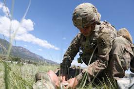 U.S. Army Spc. Patricia Burns, a combat medic assigned to 2nd ...