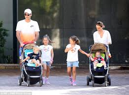 Roger and mirka have two sets of twins. Roger Federer Pushes A Stroller As He Takes His Two Sets Of Twins Out For The Day In Brisbane Daily Mail Online