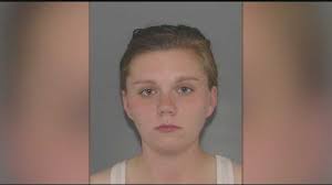 Police: Woman wounds 2 in attempt to steal purse outside store