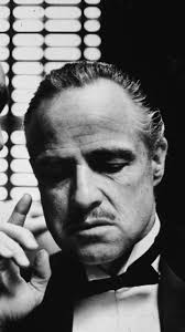 A gray and white cat sitting in marlon brando's lap. Marlon Brando Godfather Wallpapers Top Free Marlon Brando Godfather Backgrounds Wallpaperaccess