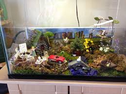 5 Awesome Ways To Repurpose A Fish Tank The Improvement Ideas In 2020 Fish Tank Garden Diy Fish Tank Fish Tank Terrarium