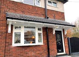 Hip roofs on two stories. Door And Window Canopies Southport Merseyside North West