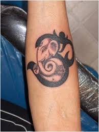 10 Devotional Om Tattoo Designs Om Tattoo Design Ganesh Tattoo Elephant Tattoos