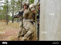 Soldiers of 2nd Platoon from the 28th Ordnance Company (EOD) enter a  building to clear it during a training exercise
