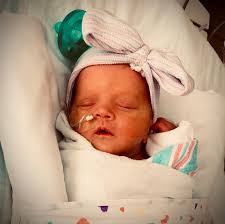 Olivia” 3/18/21 💗 she decided to arrive 7 weeks early to Darby and  Danielle. She is a fighter and so sweet at the same time. We have all  fallen for this precious