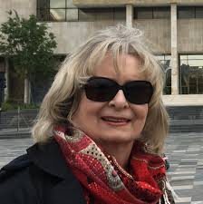 What adhesive can be used to make peel and stick tiles stick properly?