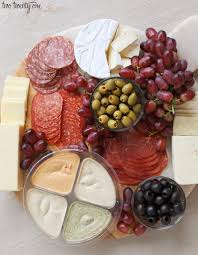 Often times charcuterie may be presented on a charcuterie  ʃɑrˌkuɾəˈri board, with the meats paired alongside other delicious foods like cheeses and fruits. Aldi Charcuterie Board