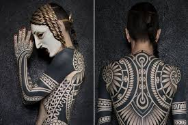 Tattoo artist chester lee of oracle tattoo shop in singapore knows this, and that's why he's come up with this unique and skillful alternative to laser removal take a look at the creative tattoos below to see the result for yourself. Woman Covered From Head To Toe In Huge Intricate Tribal Tattoo Blackout Tattoo Full Body Tattoo Tribal Tattoos