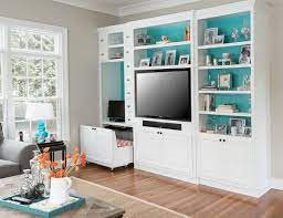 Blake grey wash 68 media console with 2 tall cabinets. Stylish And Versatile Corner Workspace In The Living Room Decoist Desk Built In Built In Bookcase Built In Computer Desk