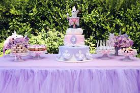 Rustic dining table and chairs featuring elegant carvings along the table skirt and along the legs and back of the chairs. Princess Sofia The First Birthday Party Popsugar Family