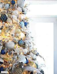Navy, gold, silver, with touches of tartan, stripes and light blue are what you'll find throughout our main living area this season, and being the blue and white lover that i am, i think this is my favorite christmas theme to date. Flocked Christmas Tree Decor Blue Silver Gold Citrineliving