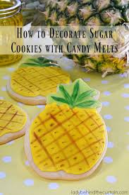 This is optional, but as soon as the cookies come out of the oven they'll melt right down into the cookie, making them extra pretty. How To Decorate Sugar Cookies With Candy Melts