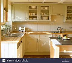 beech worktops on cream painted units