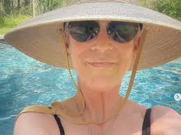 Jamie Lee Curtis Poses in Swimsuit and Sun Hat in IG Pool Selfie
