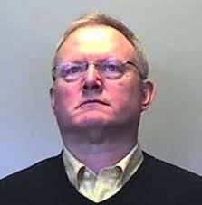 Lansing jail officer charged, suspended for allegedly assaulting inmate