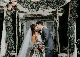 Greenery And Fabric Draped Wedding Ceremony Arch 1928 Planning Company Grand Rapids Wedding Barn Wedding Michigan Wedding Venues