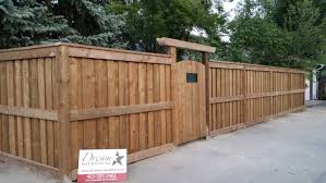 Brown Pressure Treated Ultra Fortress Style Fence With Overlapped Boards Fence Design Wood Fence Design Backyard Fences