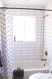 Navy subway tiles accentuate the bathtub space and white paint. Millie S Remodel How To Tile A Shower Tub Surround And Never Replace Caulk Again Pretty Handy Girl