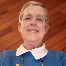 Beautiful, tall Dracaena (Corn Plant) that makes an instant statement in  any room. This is a mature, established plant with a strong trunk and lush  green foliage — perfect for living rooms,